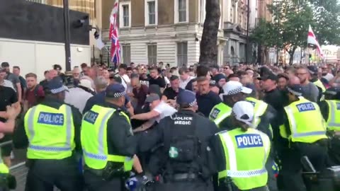Police put on riot helmets outside Downing Street after “Enough is Enough”