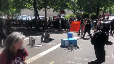 Aug 4 2018 Portland 01.11 Antifa blocks the street police say people are throwing objects at them