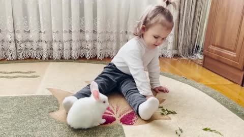 Cute_Baby_Feeding_Baby_Bunnies