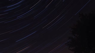 Bright star trails across the night sky