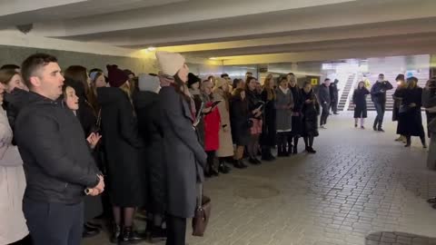 Christians singing praise to Jesus Christ while sheltering inside a subway station in Kiev