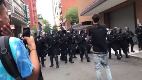 Aug 17 2019 Portland 1.10 police slowly back away from antifa who cheers
