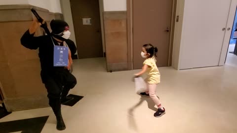 Little Girl Battles a Ninja Statue in Osaka