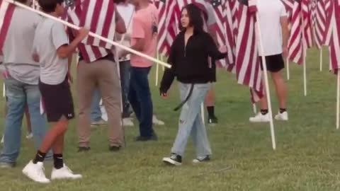 High school football team plants 3,000 American flags