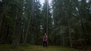 Man Standing in Forest