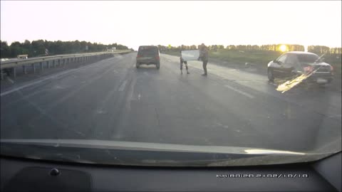 Two Men Walked Their Fridge Across A Busy Russian Highway Like It's No Big Deal