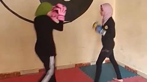 Girls fighting for the black belt