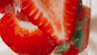 Sliced strawberry in water. Close view of Sliced strawberry