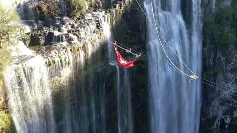 AN EXTREME WAY TO LIE IN A HAMMOCK~IT’S RIGHT ABOVE THE CASCADING STREAMS OF CASCATA DA SEPULTURA WATERFALL IN RIO GRANDE DO SUL BRAZIL