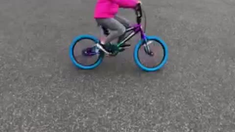 Mia on a bike