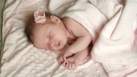 Newborn Little Baby Girl Is Sleeping On The Bed, Sweet Dreams Of Little Baby, Healthy Sleep