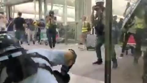 Police and protesters clash at Hong Kong Airport