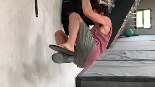 Rock Climber Practicing One Finger Hang