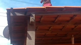 Young Child Playing on Roof and Dad Saves Him