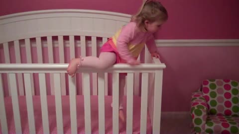 climbing out of her crib