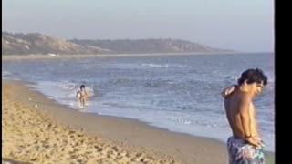 Toddler Sprinting Down Beach Crashes Into Other Kid