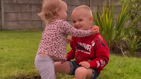 Young Siblings Show Affection Before Shoving