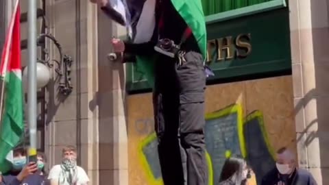 Pro Hamas supporters burn the Israeli flag in Glasgow. Deport