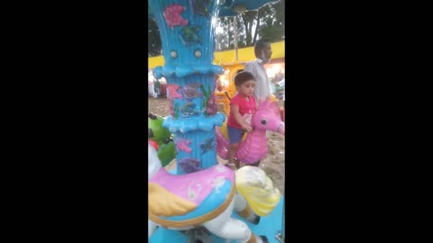 Wow baby playing in a fair