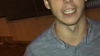 Music spanish guy button up shirt yelling into camera