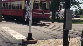 Vintage Trolley At The Illinois Railway Museum Passing a Pair Of Vintage Wig-Wag Crossing Signals