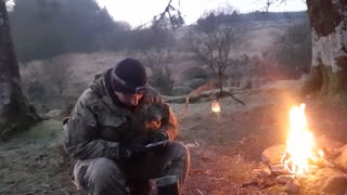 Heating up my Mre meal on a campfire. Riverside wildcamping.