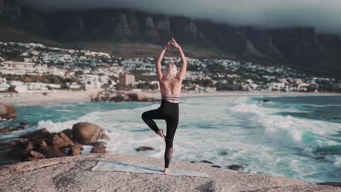 This Woman Doing Yoga On Seashore l Improves strength, balance and flexibility.