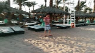 Tourist Walking On Beach In Sharm El Sheikh