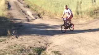 Guy red bike dirt ramp jump fail flies into lake water