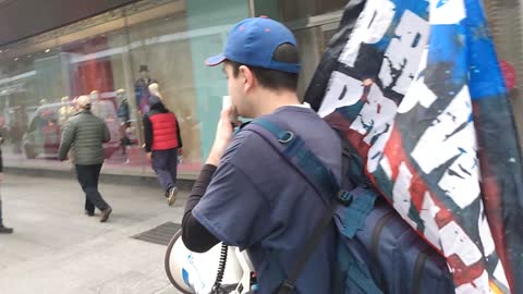 Toronto freedom march on Bloor street: warning the public about microchips that came out in Sweden.