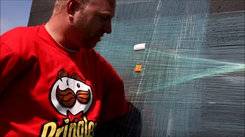 Armless Archer shoots a Cheez-it at 100 yards