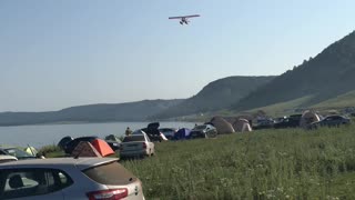 water plane flies over the reservoir