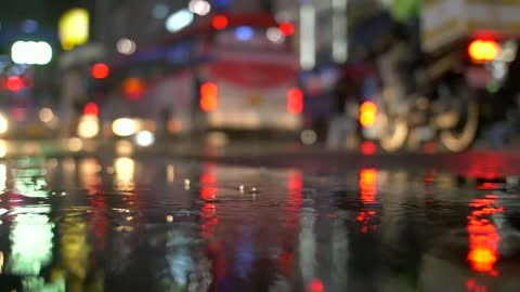 Brake Lights Reflected in Rain