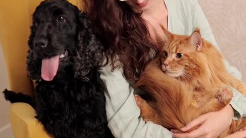 A woman holding a cat