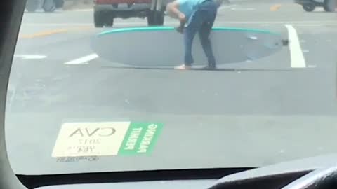 #kookoftheday guy picks surfboard out of road and puts in van