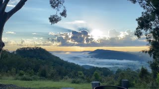 Stunning View as Sunrise Peeks Through the Clouds