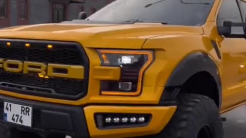 Yellow Ford raptor SUV