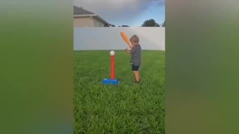 Boy hits dad in the face with ball