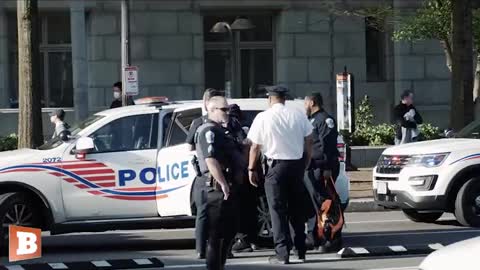 Climate Activist Arrested After Scaling D.C. Mayor's Office Popping Smoke Flare.