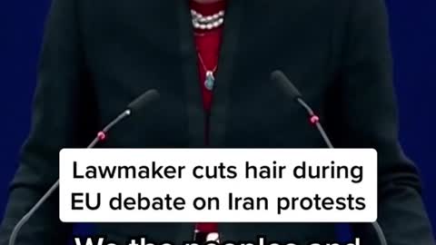 Lawmaker cuts hair during EU debate on Iran protests