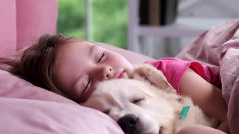 Little girl a sleep with her dog