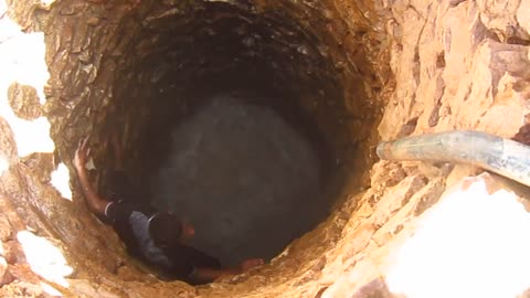 Children swim in a deep well