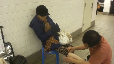 Luodong Massages Feet Of Mature Black Woman At Subway Station