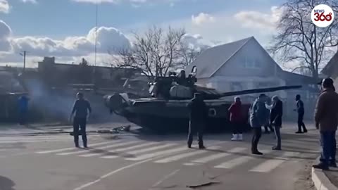 Fearless Ukrainian man kneels in front of marauding Russian convoy in Tiananmen tank moment