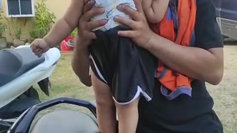 Adorable cute baby trying to drive ninja bike , ready to stunts,