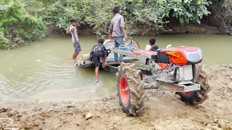 #79-driver tractor go transport water at the river