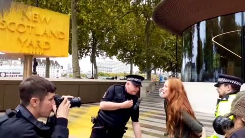 Outside the new Scotland yard earlier today where a protester sprayed yellow pai_2