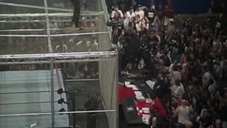 Undertaker threw Mankind off the top of the cell through the announce table,