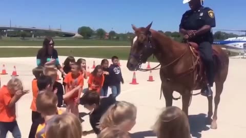 Adorable Horse Cops Playfully Engage with Kids