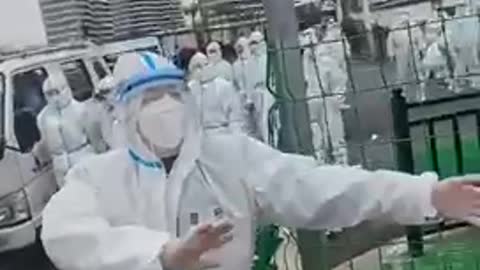 Shanghai Police in Hazmat Suits beat people not complying